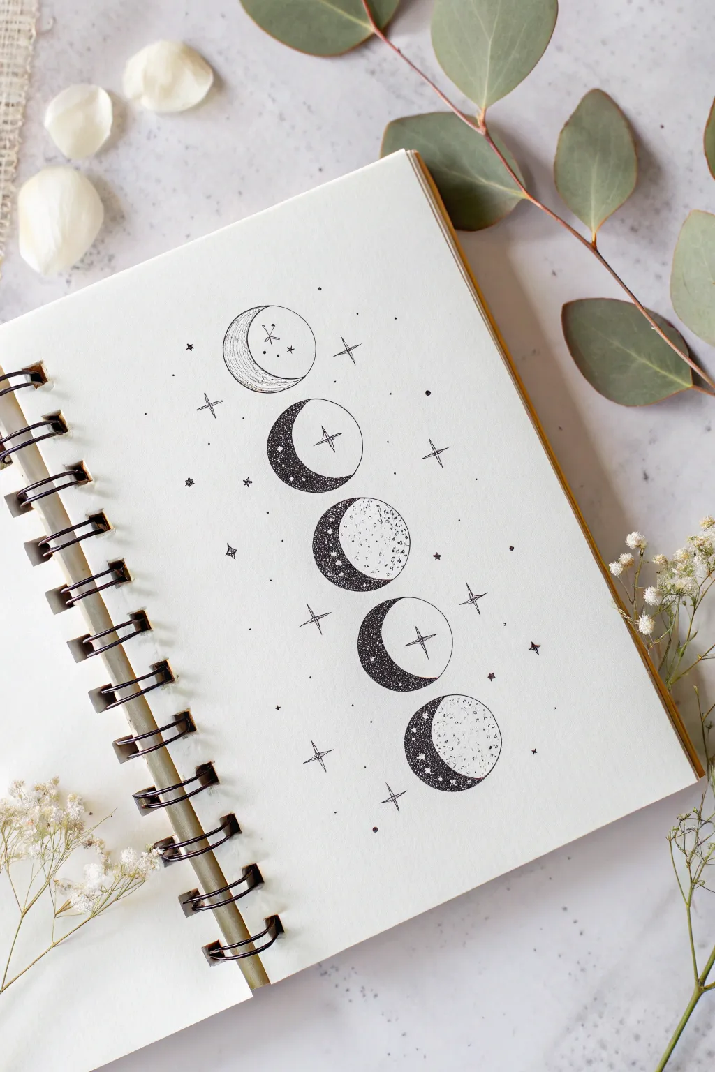 Minimal moon phase line art with soft gray wash and tiny sparkles for calm drawing inspiration