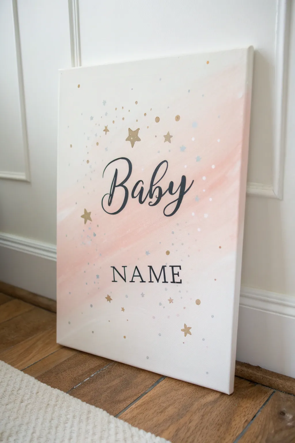 Soft blush ombre canvas with elegant script name and tiny star dots for a sweet nursery keepsake