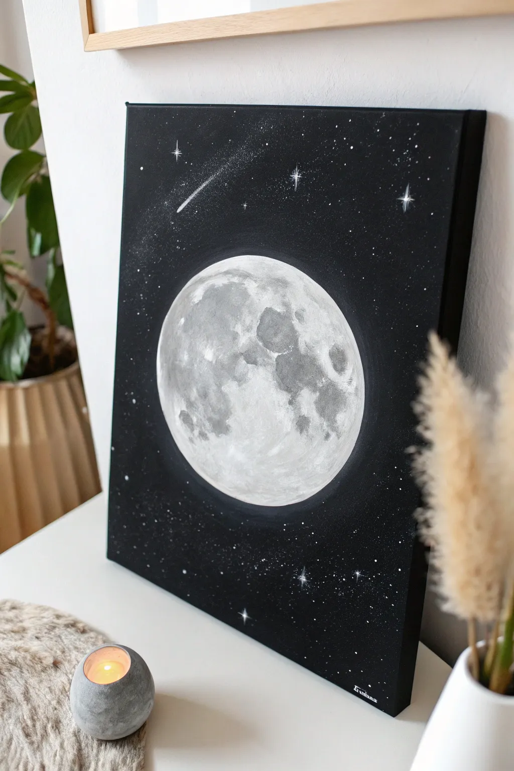 Glowing white moon on a deep black sky, with soft haze and tiny stars for bold contrast