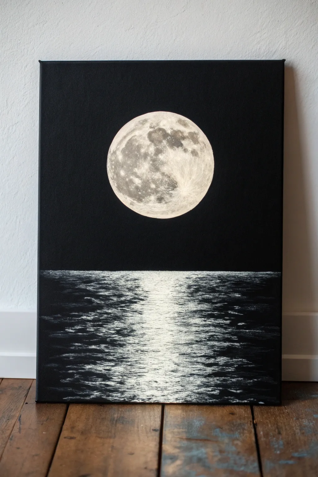 Glowing white full moon with a shimmering reflection on calm dark water, pure minimalist contrast.