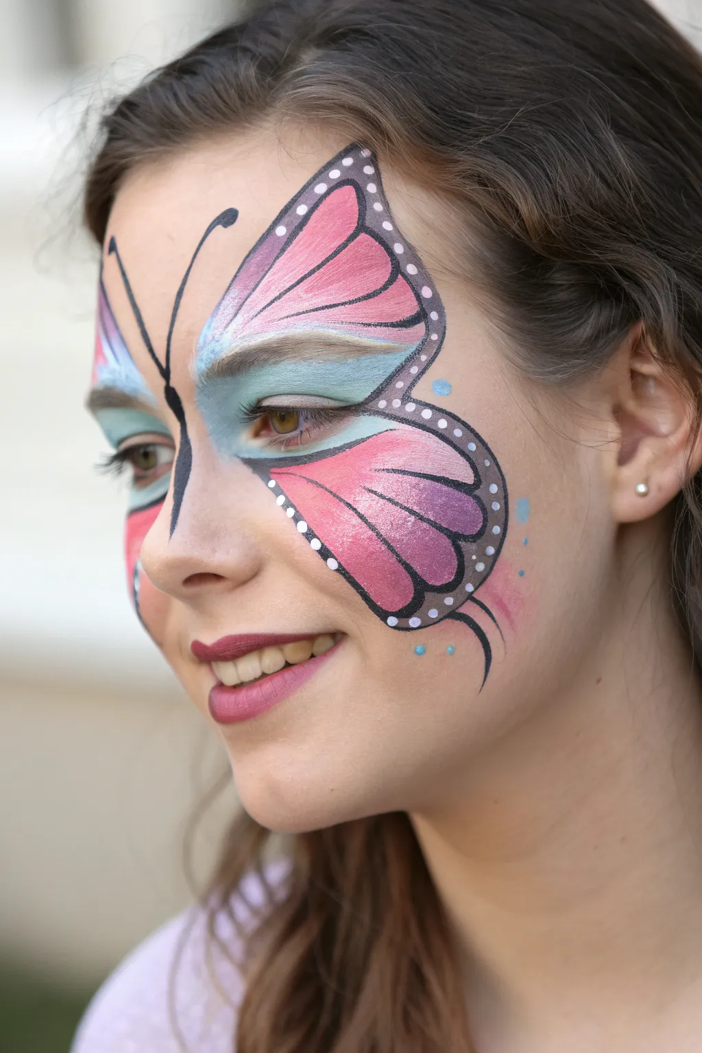 Classic full-face butterfly mask with crisp black outlines and softly blended wings