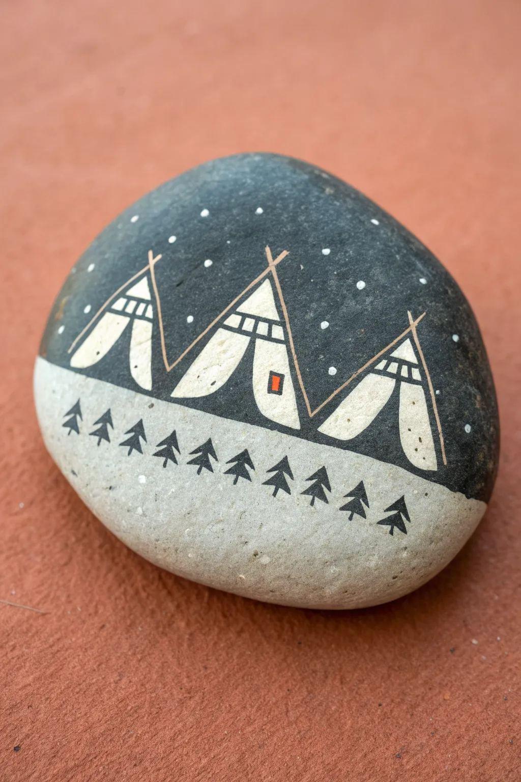 Minimal tent silhouette painted rock in calm boho neutrals, perfect for easy camping craft.