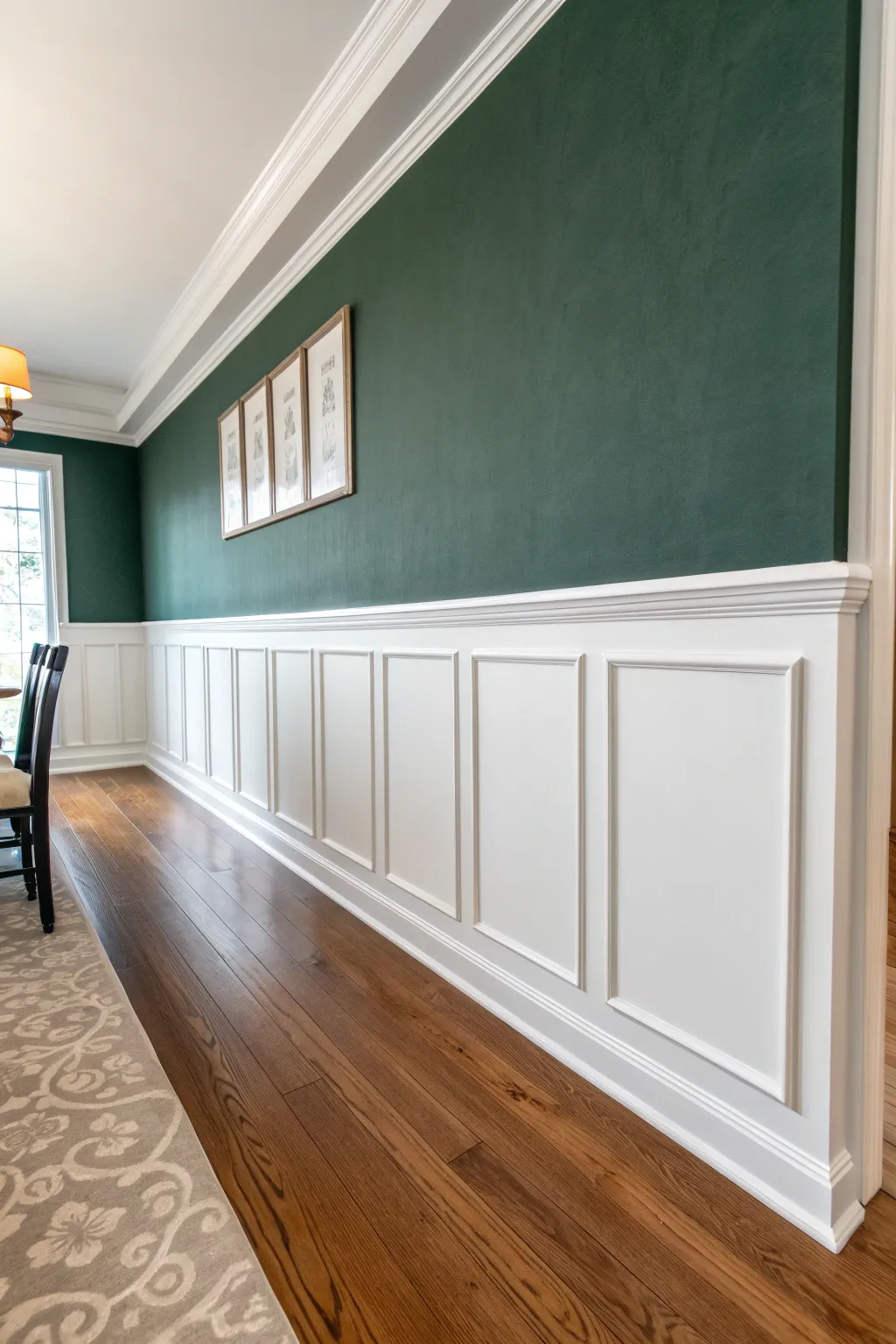 Classic two-tone chair rail: deep charcoal below, soft warm white above for calm contrast.