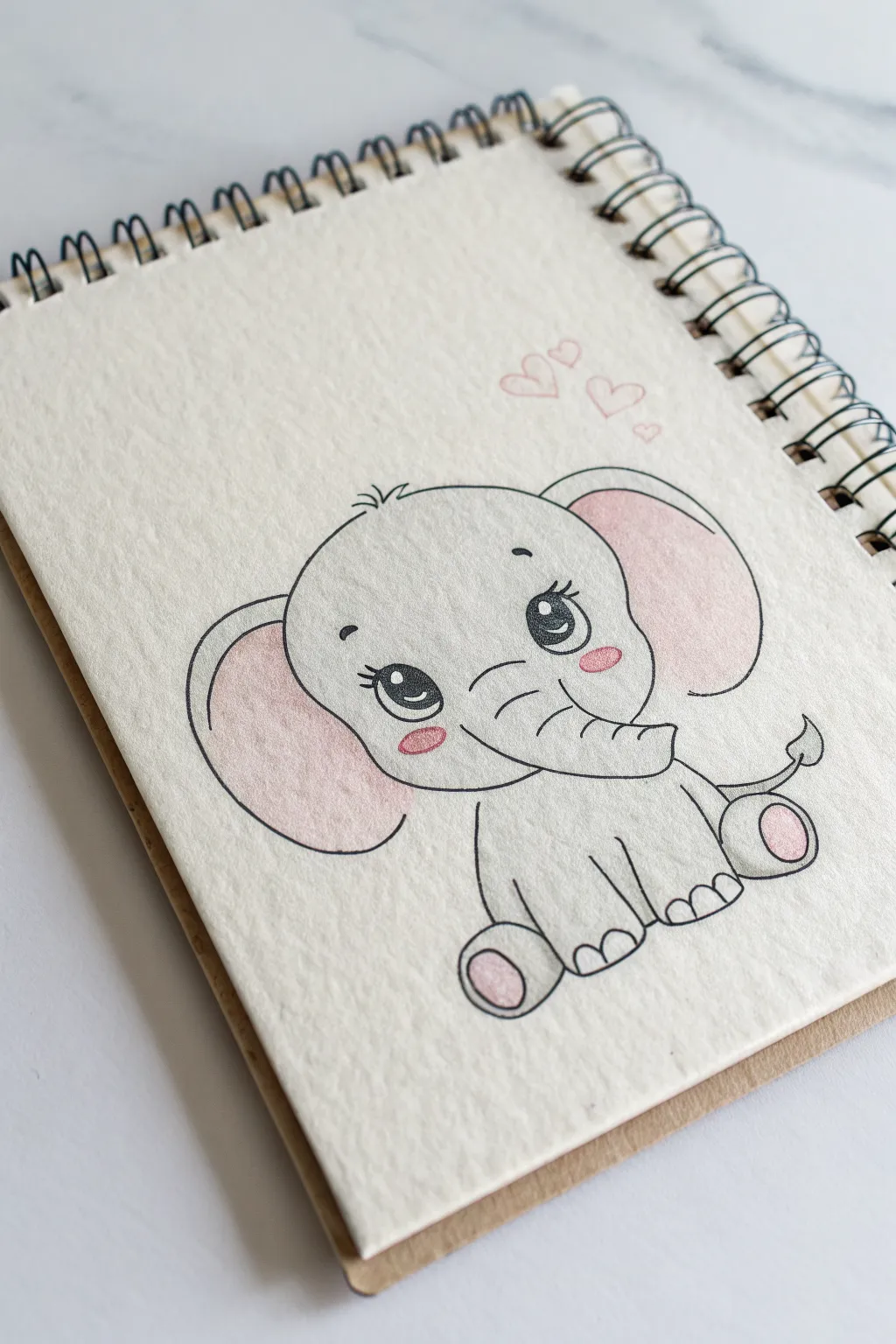 Classic baby elephant with big eyes, simple shapes, and soft blush for an easy cute sketch.