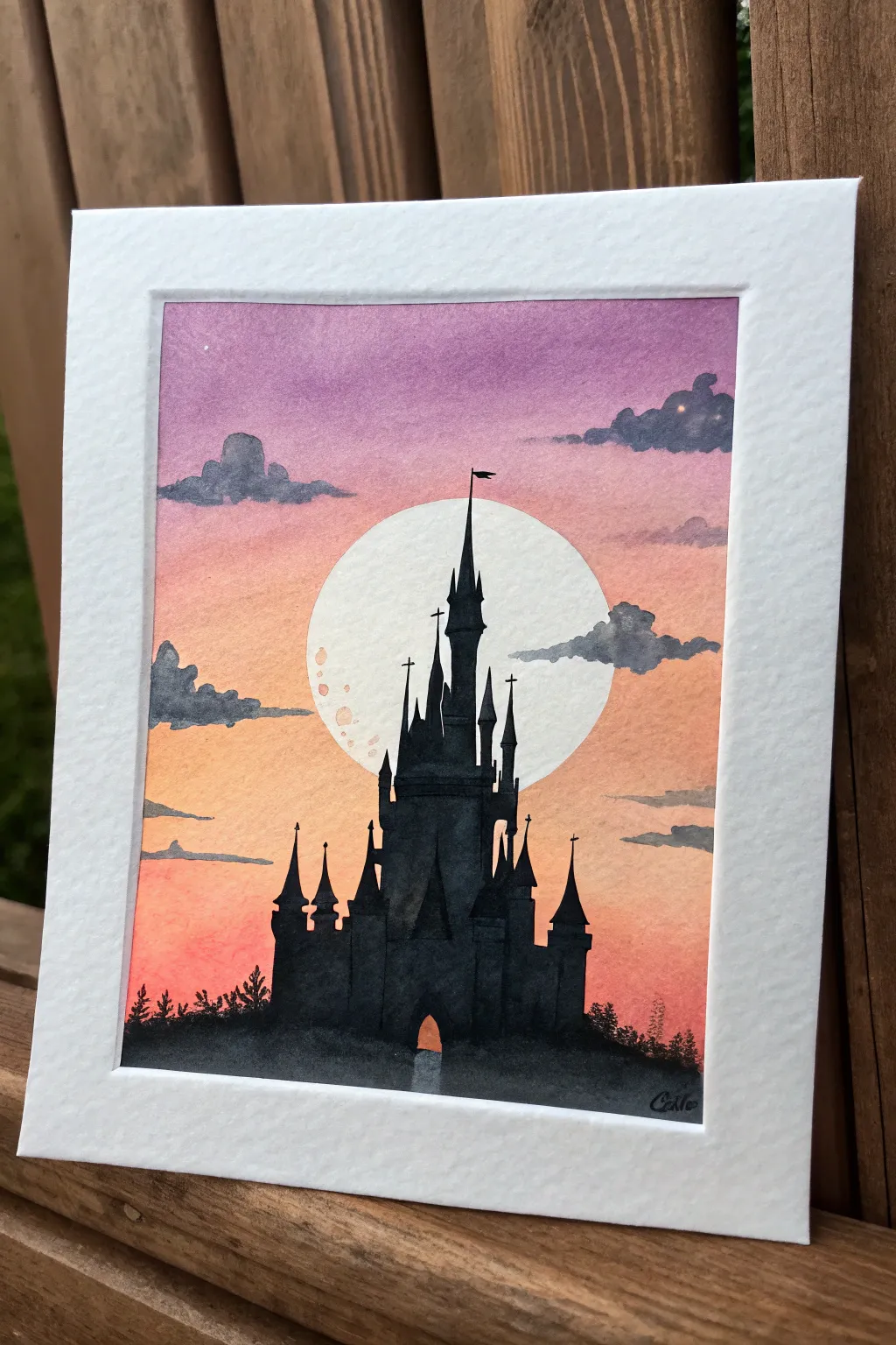 Paint a dreamy storybook castle silhouette against a peach-to-lavender sunset glow.
