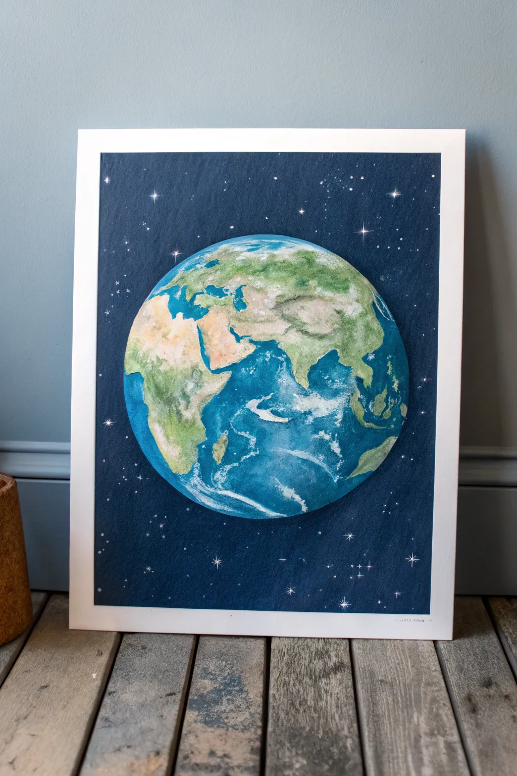 Classic blue marble Earth glowing in dark space, a calm minimalist painting idea to recreate