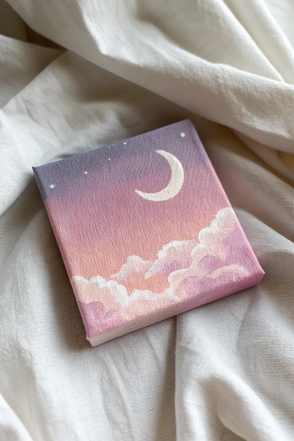 Mini pastel sky canvas with crescent moon, soft clouds, and airy linen backdrop