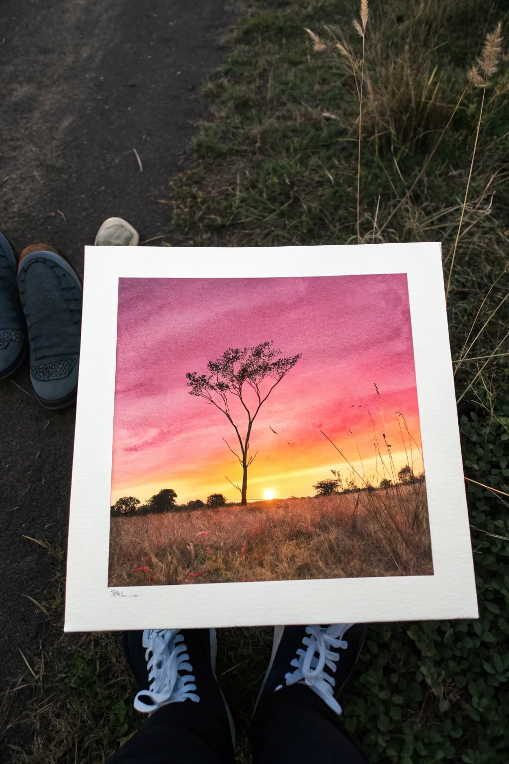 Minimal sunset silhouette horizon with crisp shadows and a glowing watercolor gradient sky