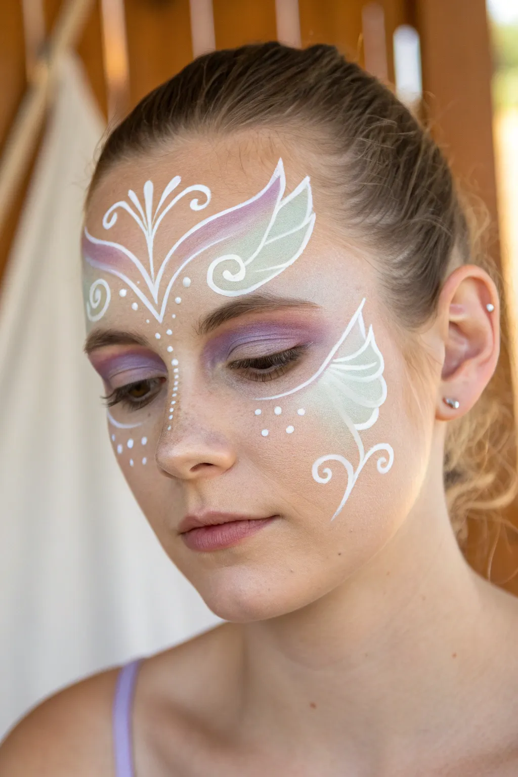 Classic winged fairy mask with crisp white swirls, minimalist boho palette and clean symmetry