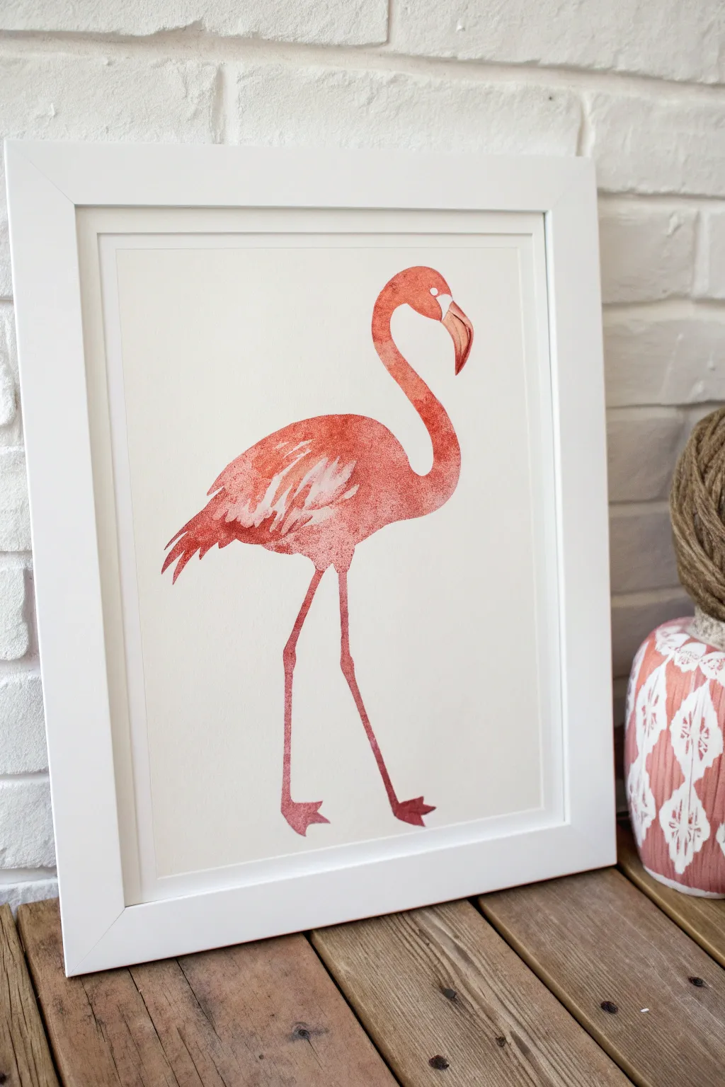 Classic side-profile flamingo silhouette in soft coral tones, minimal lines and bold contrast.