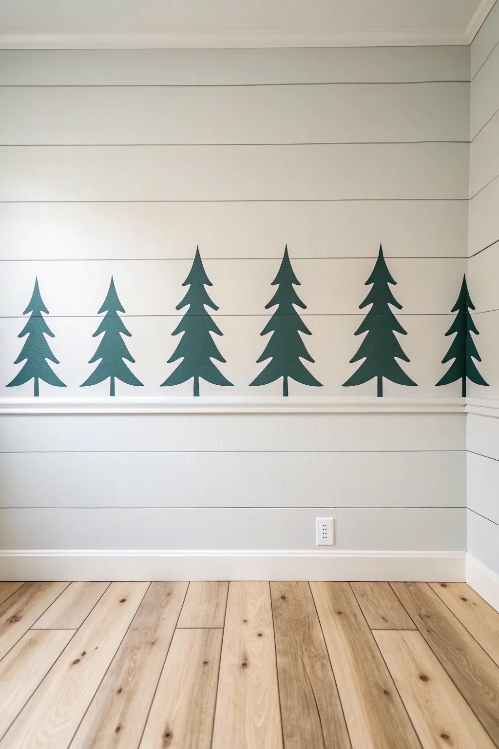 Minimal pine tree silhouettes in one bold color for an easy Scandinavian forest wall accent.