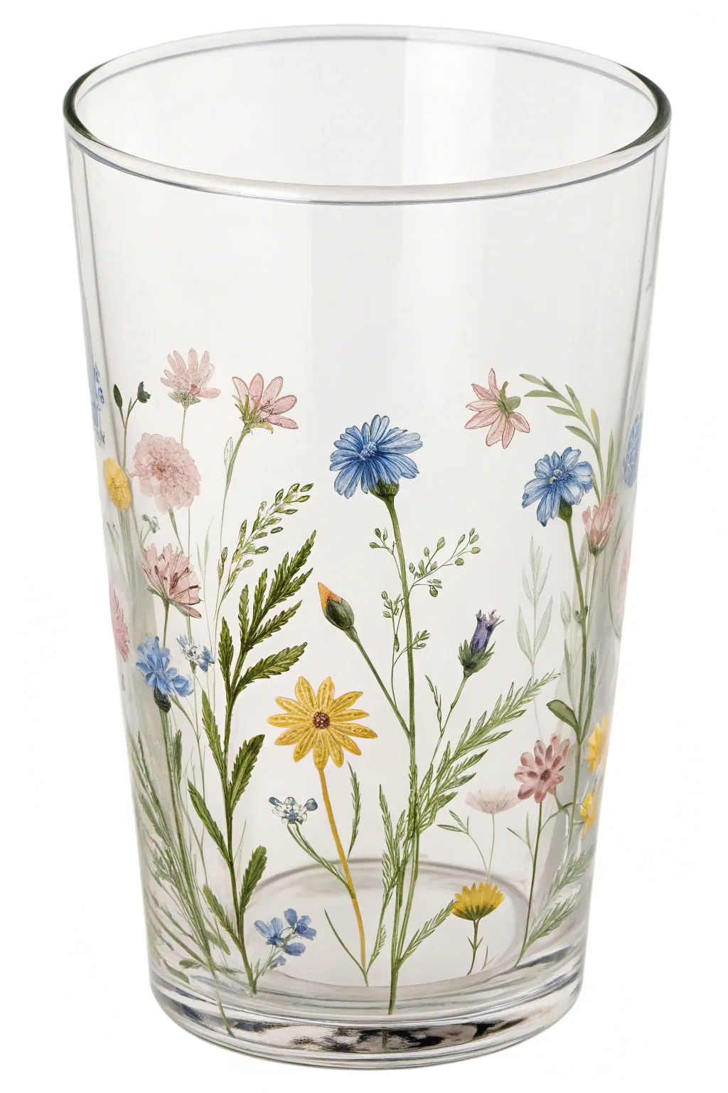 Clear glass cup with a delicate wildflower wraparound border, soft daylight and crisp contrast