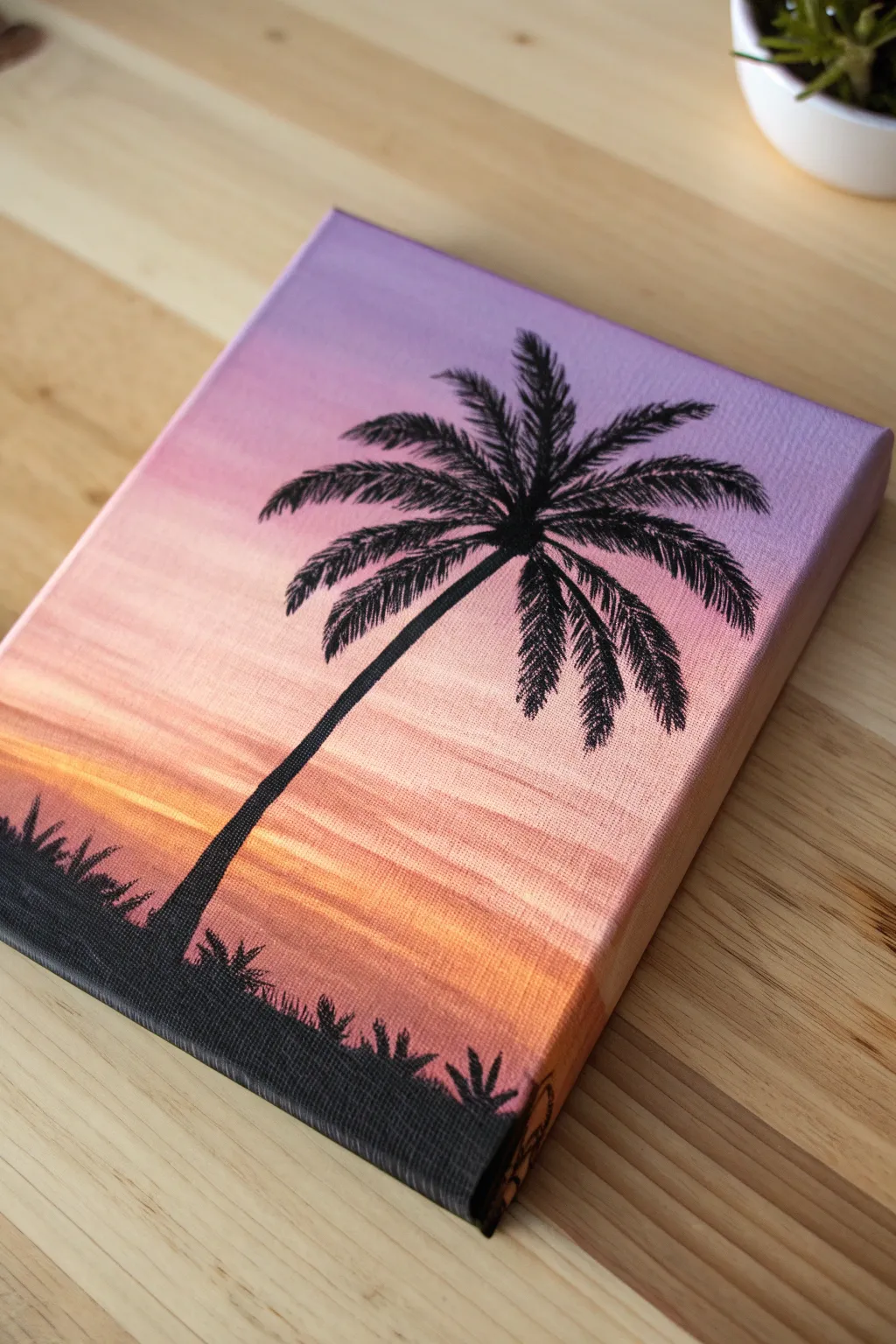 Paint a dreamy ombré sunset and finish with a bold, simple silhouette for instant drama.