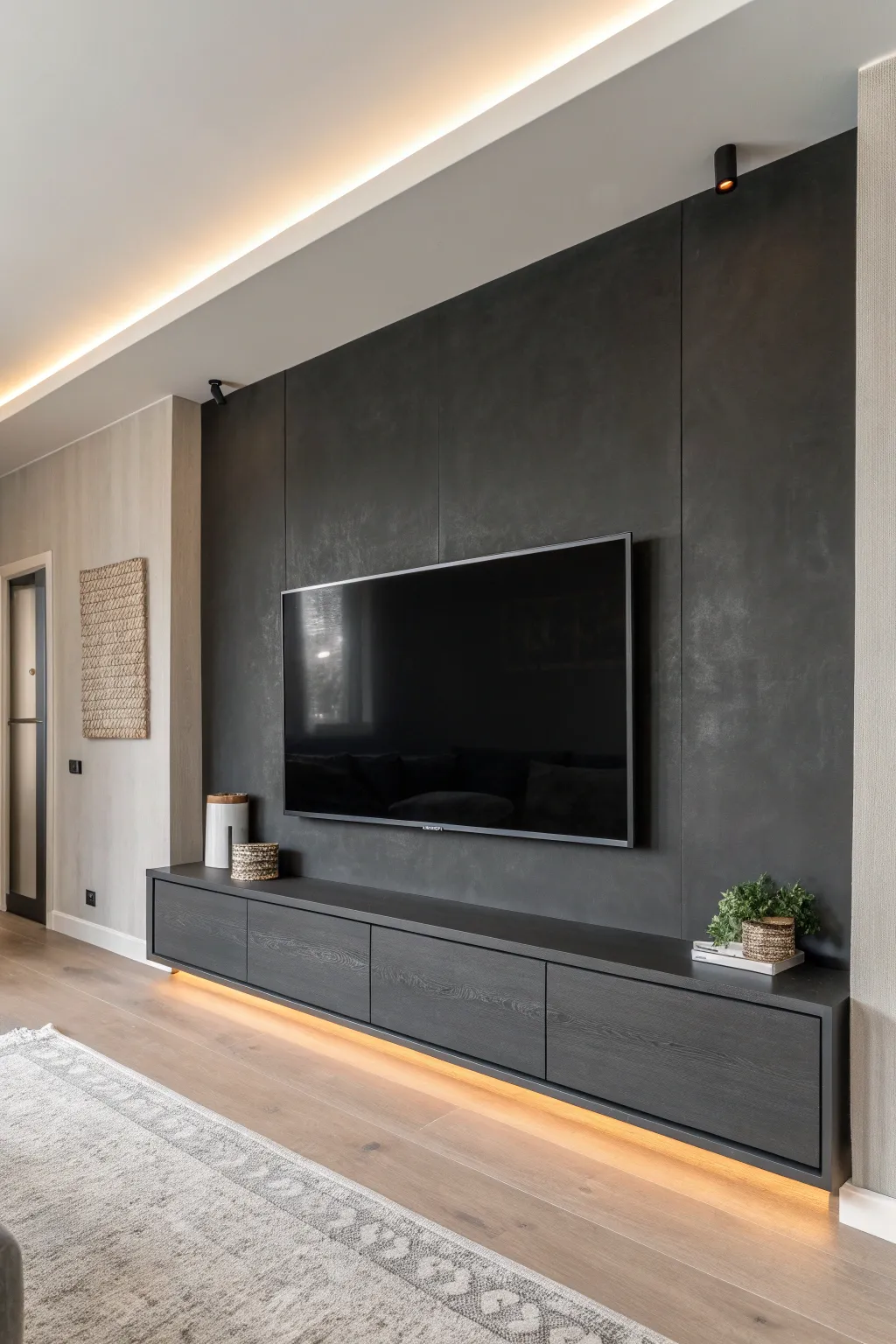 Matte charcoal media wall + warm glow makes the screen pop for a modern, cozy theater vibe.