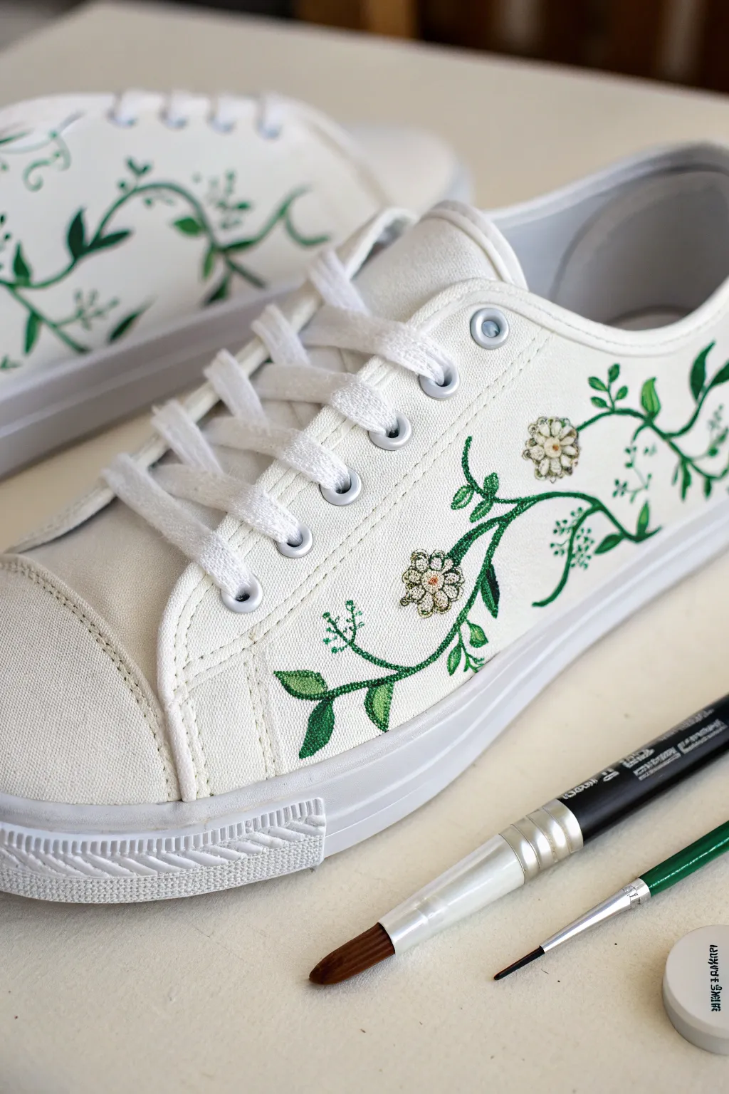 Simple floral vines on a white canvas sneaker, crisp outlines and calm Scandinavian boho styling.
