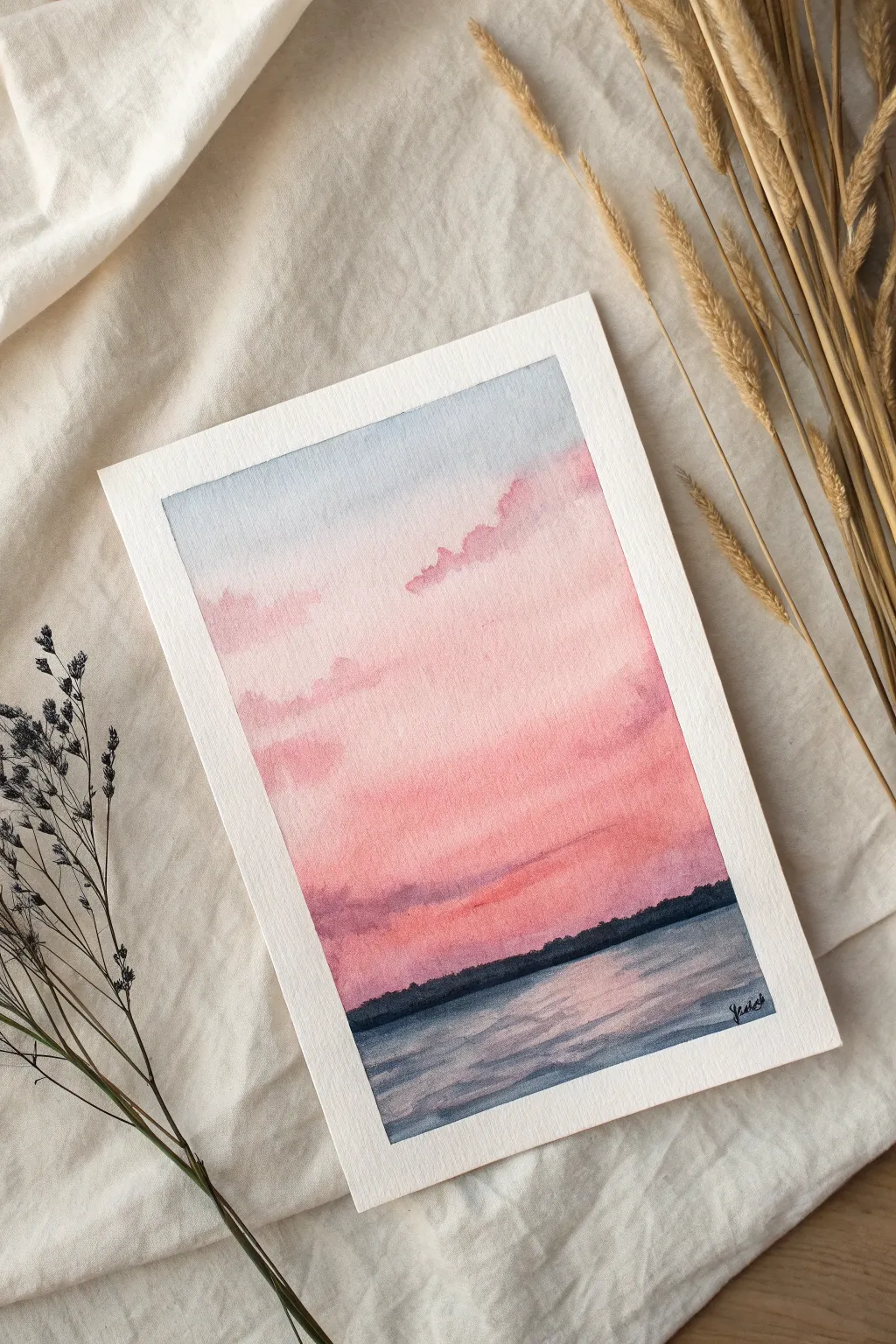 Paint a pink-to-peach sunset gradient wash with a crisp dark horizon line, calm and glowy.