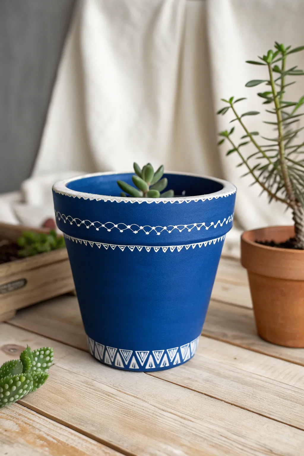 Bold solid color pot with a crisp white rim, styled simply on wood for clean decor vibes.