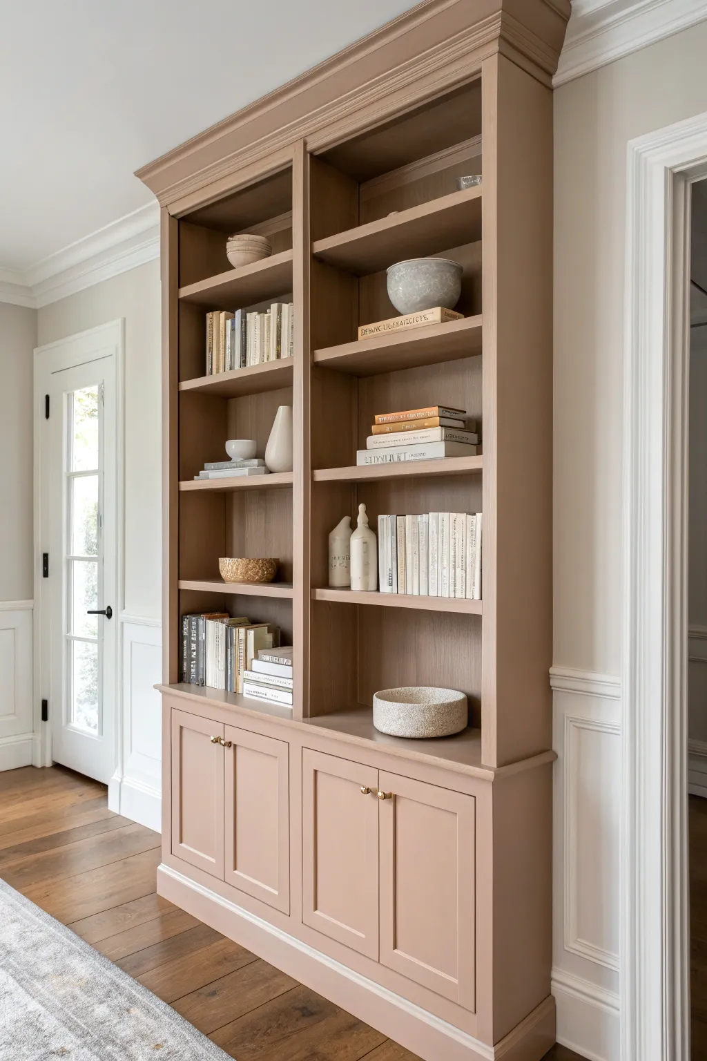 Timeless solid-color bookshelf styling with minimal books and ceramics for a clean, classic look