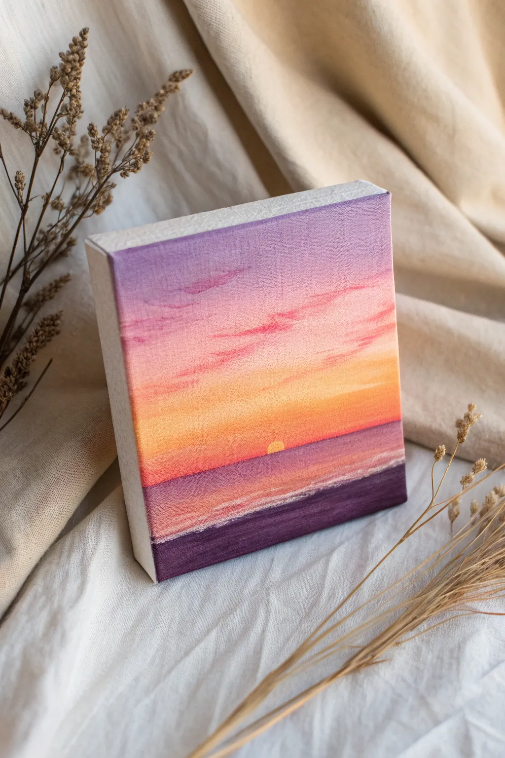 Paint a calming sunset gradient sky on a mini canvas, simple blends and clean horizon.