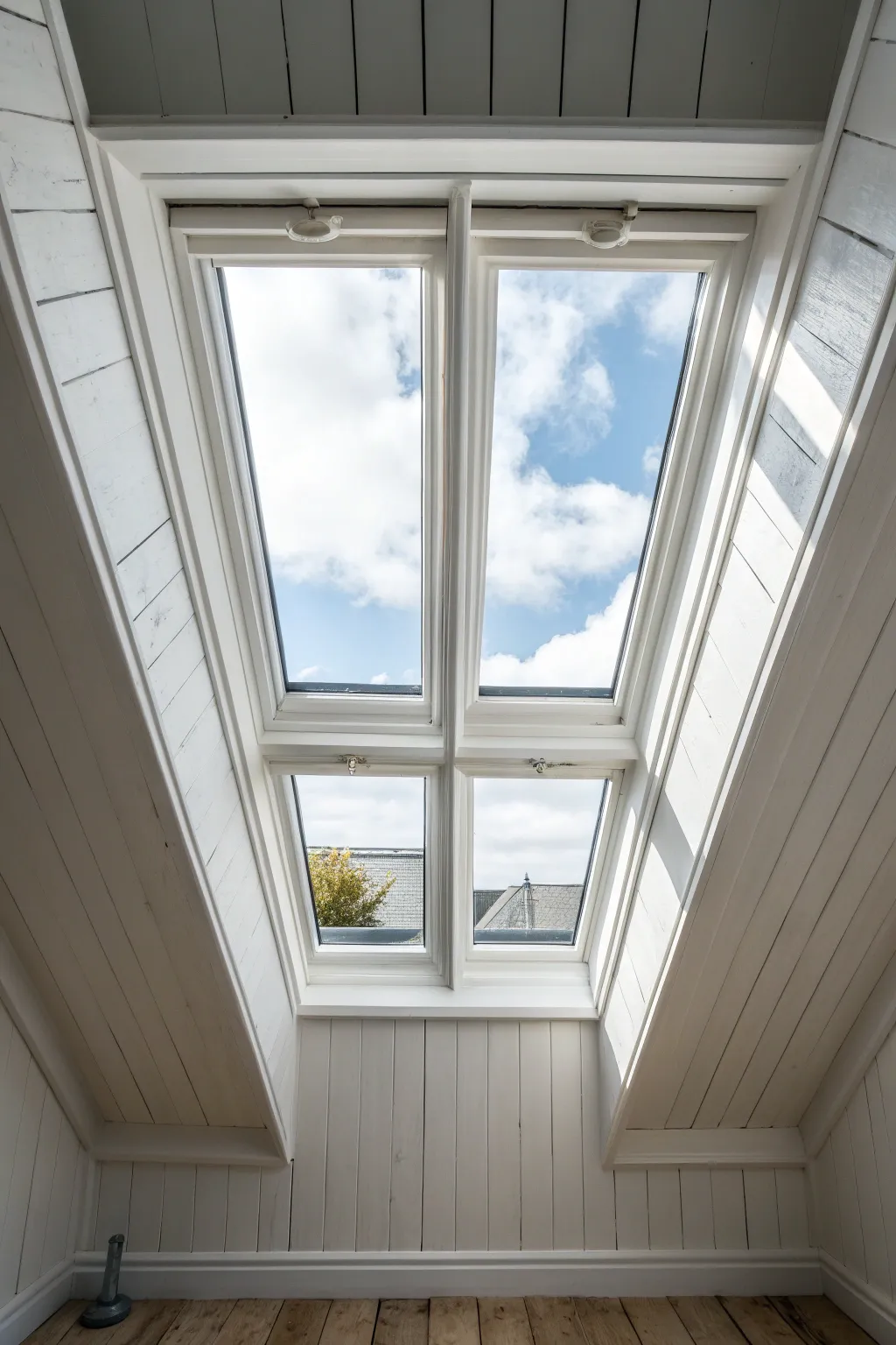 Classic bright-white skylight shaft that floods the room with crisp daylight and airy calm