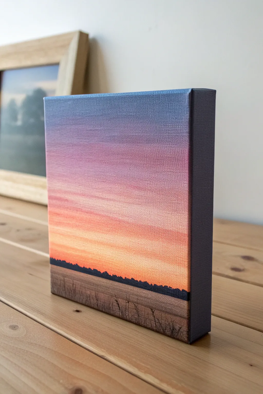 Tiny square canvas with a glowing sunset gradient and crisp horizon, minimalist and calm.
