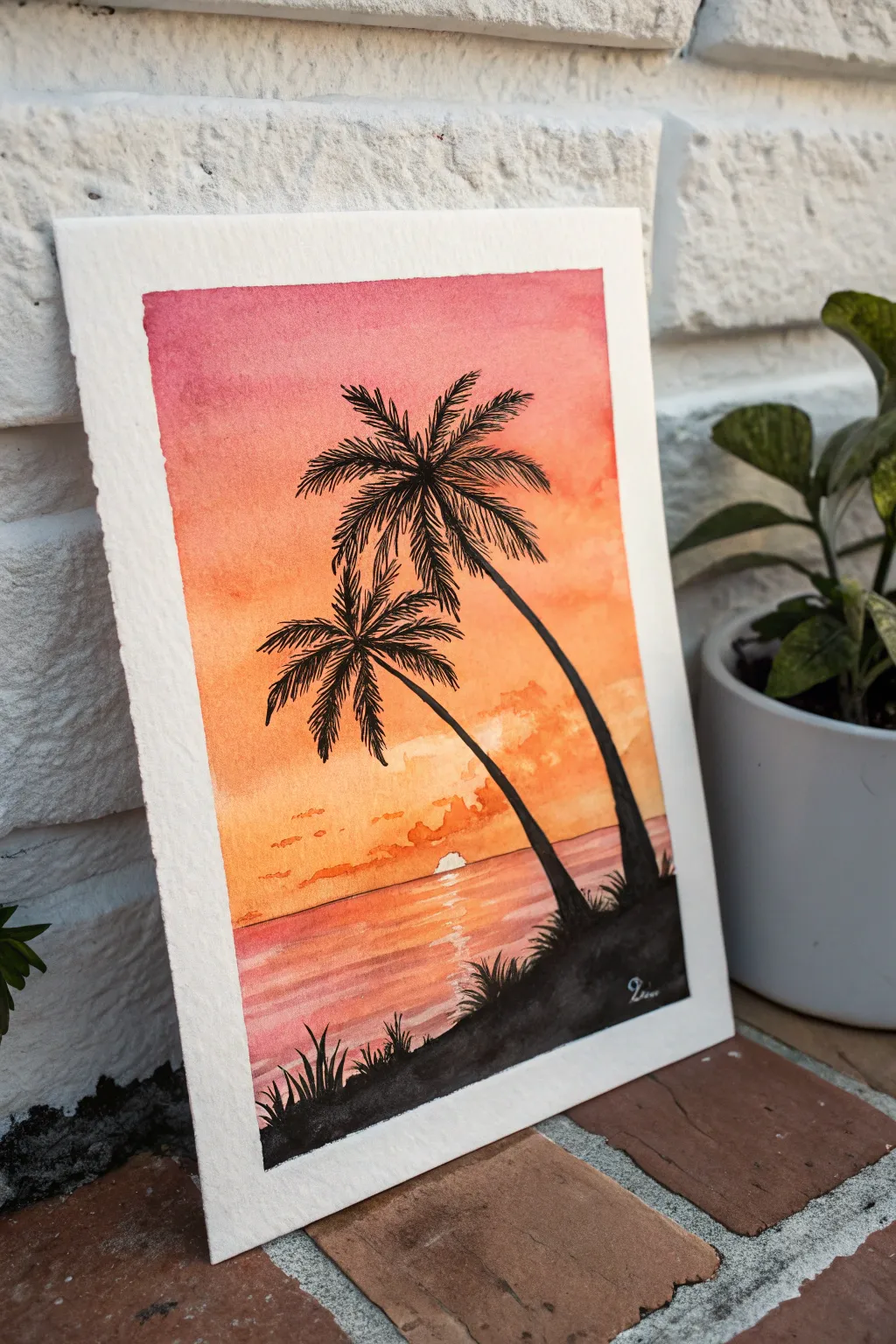 Classic palm tree beach silhouette with a warm orange-pink sunset gradient and bold black contrast.