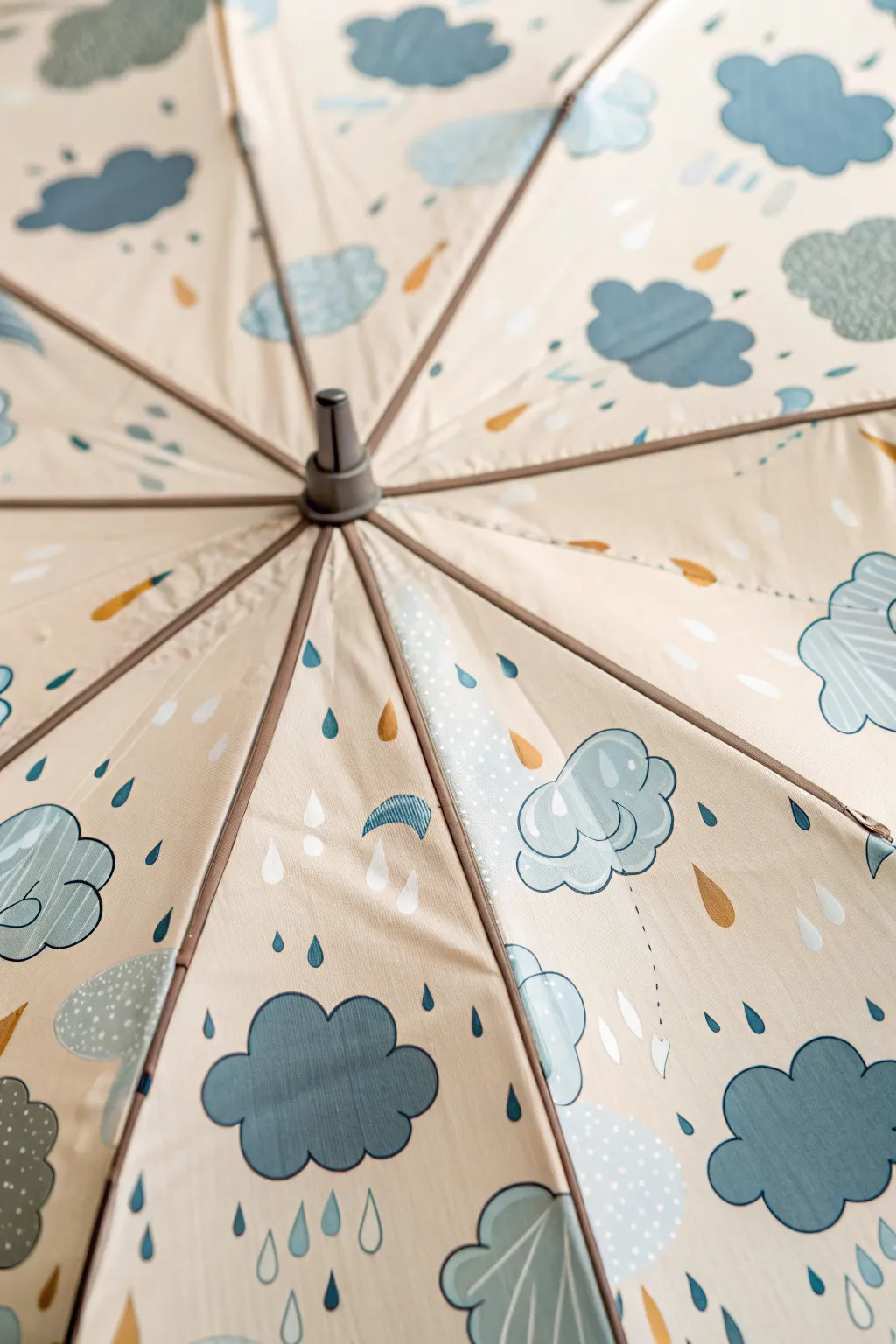 Minimal cloud and raindrop umbrella close-up with cozy rainy-day, Scandinavian boho vibes