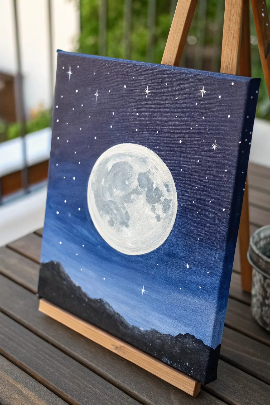 Beginner acrylic idea: a soft glowing moon with tiny stars on a deep midnight gradient