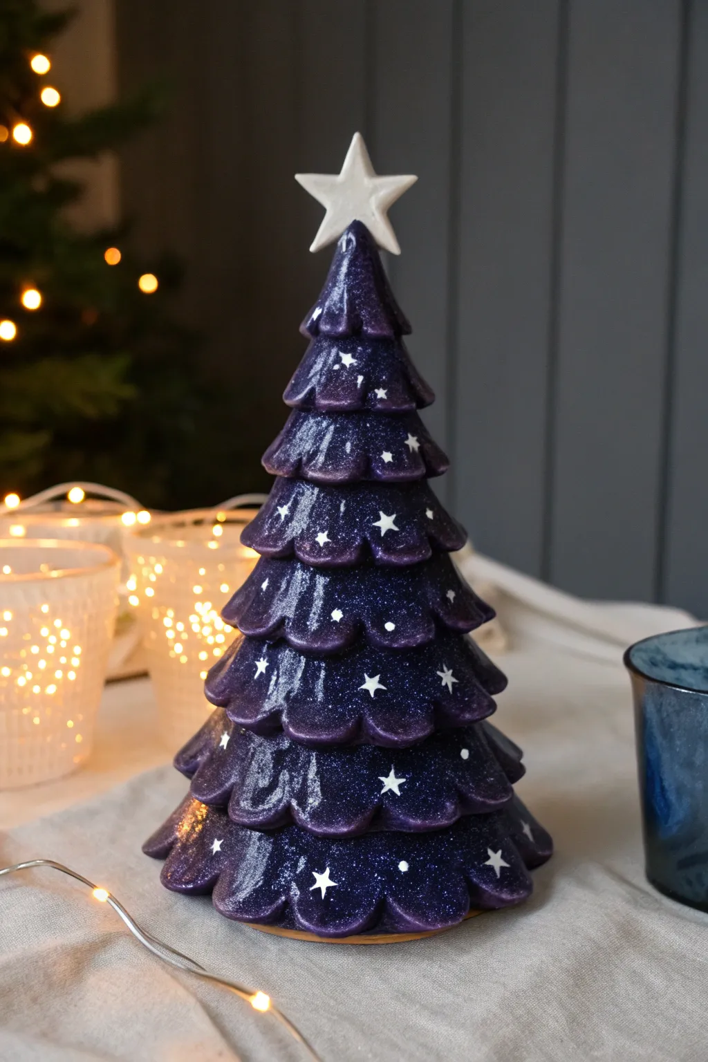 Night-sky galaxy ceramic tree with white star splatter and glowing bulbs like constellations