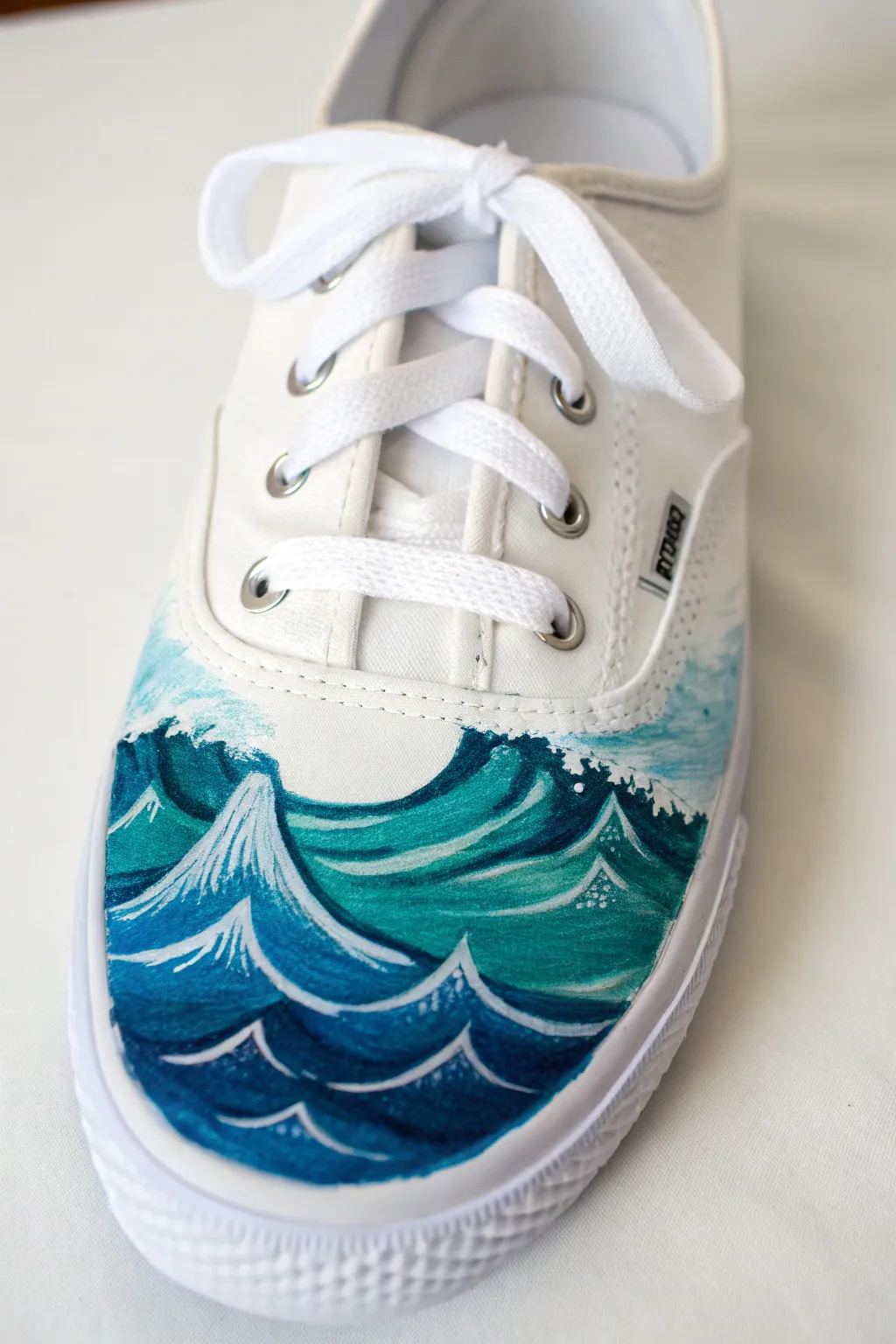 Ocean wave side panels in layered blues with crisp foam highlights for a serene shoe upgrade.