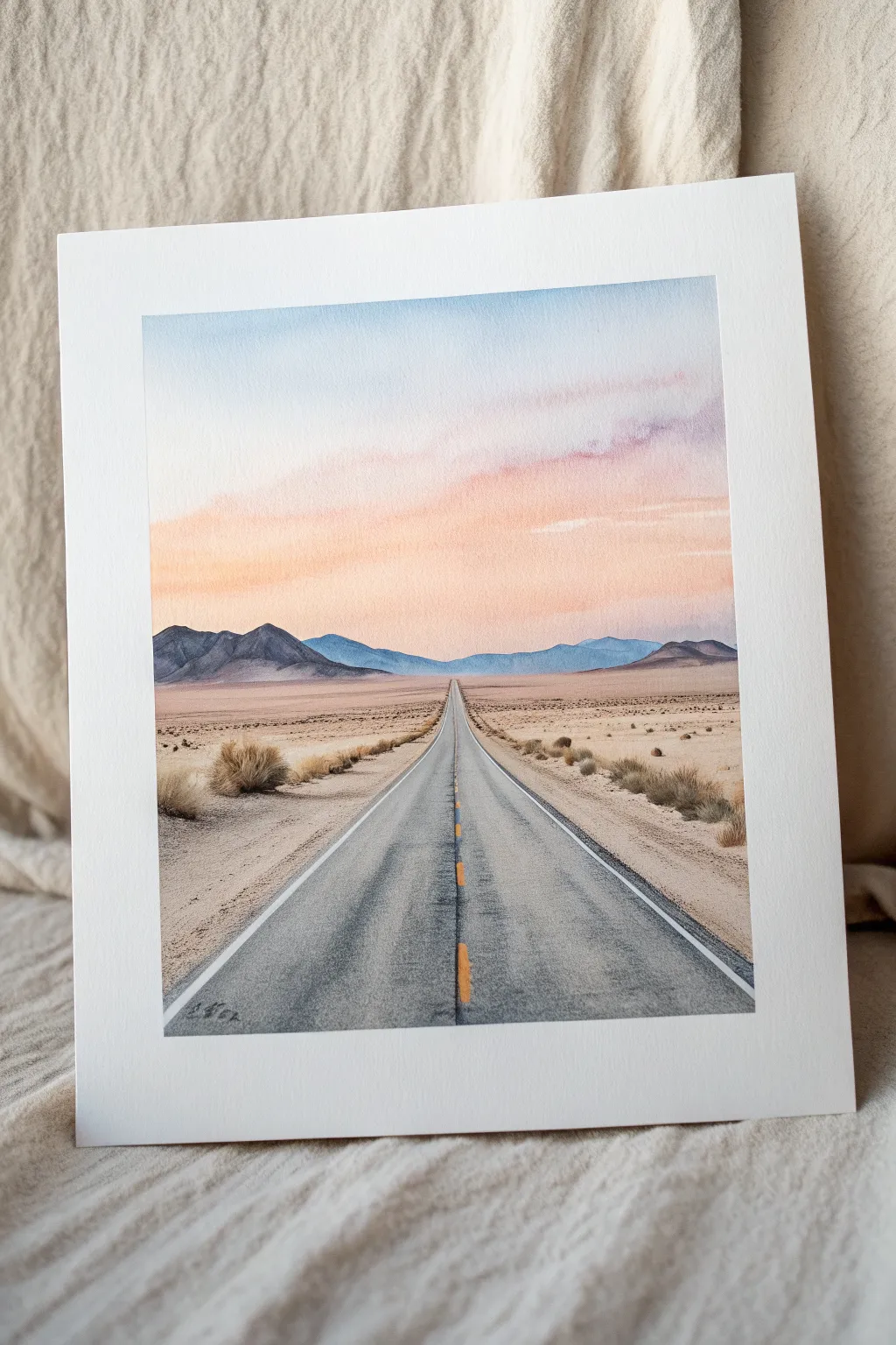 Paint a minimalist desert road disappearing into soft mountains and a calm gradient sky