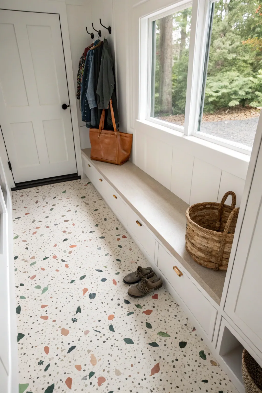 Budget terrazzo vibes: layered speckles over a light base for an easy painted concrete floor