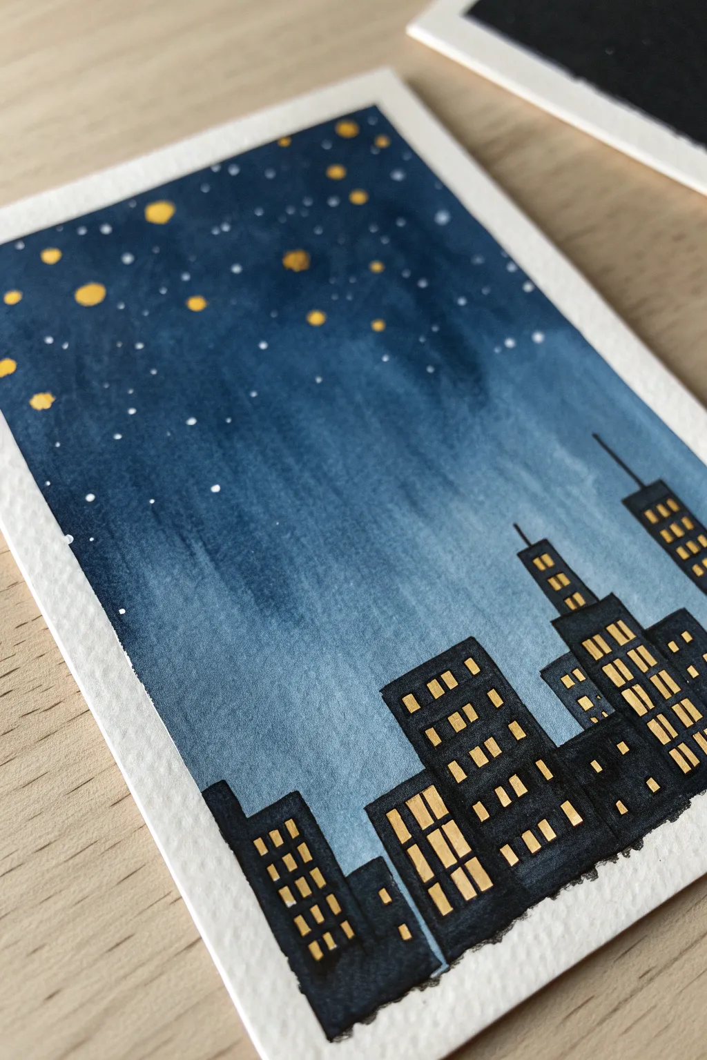 Easy dark painting idea: minimalist night skyline silhouettes with cozy window dots