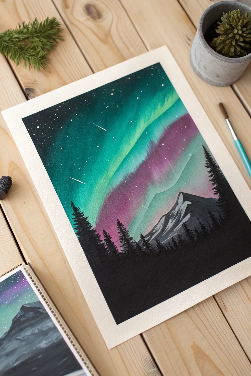 Paint a glowing gouache aurora on black paper with crisp stars and a simple silhouette.