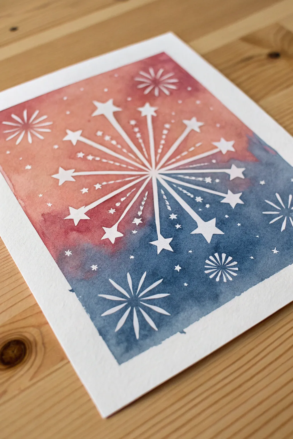 Negative space fireworks with tape masks and soft sponged color, simple and striking