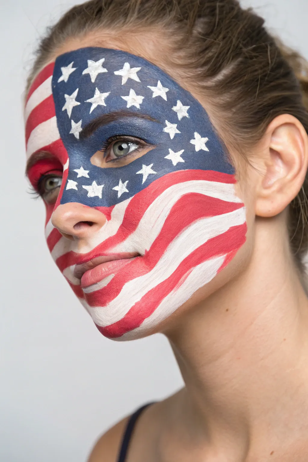 Bold full-face flag mask with waving stripes and star field, a striking Fourth of July idea