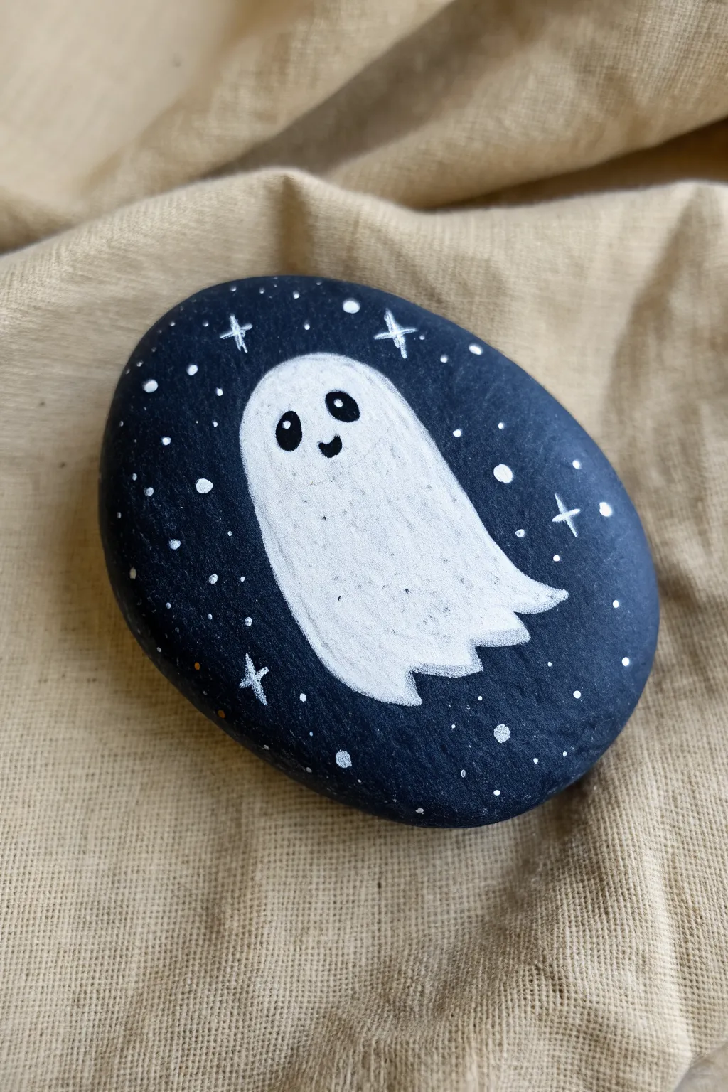 Paint a minimalist starry-night ghost rock with crisp contrast and calm Scandinavian vibes.