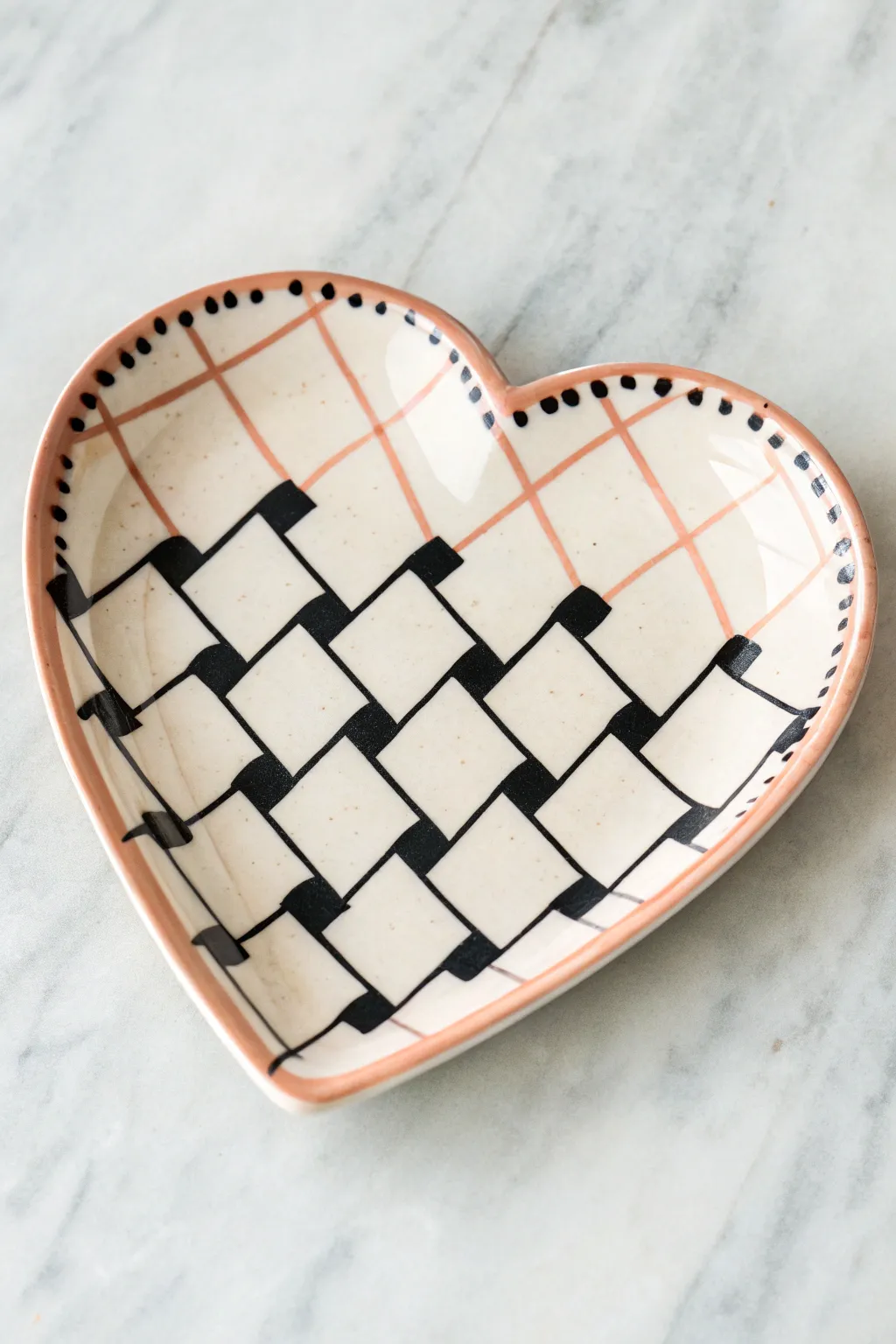 Modern checkerboard heart plate in crisp black and cream, minimalist boho styling.