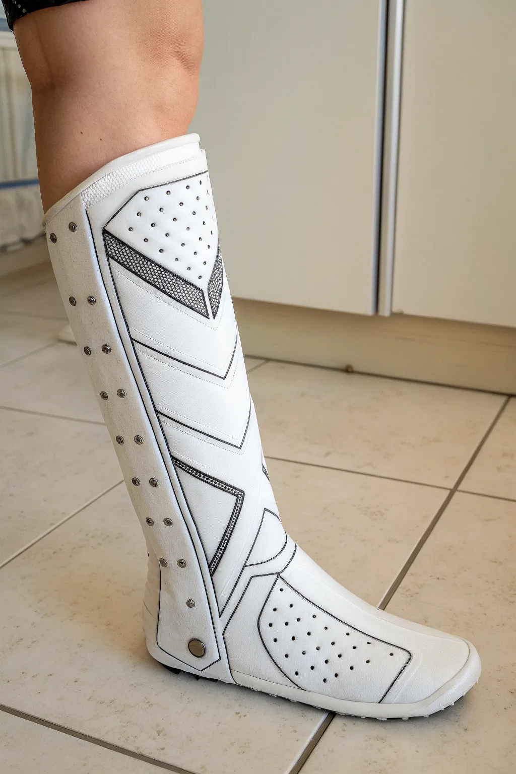 Turn a plain leg cast into sleek superhero armor with minimalist panels and rivet details.