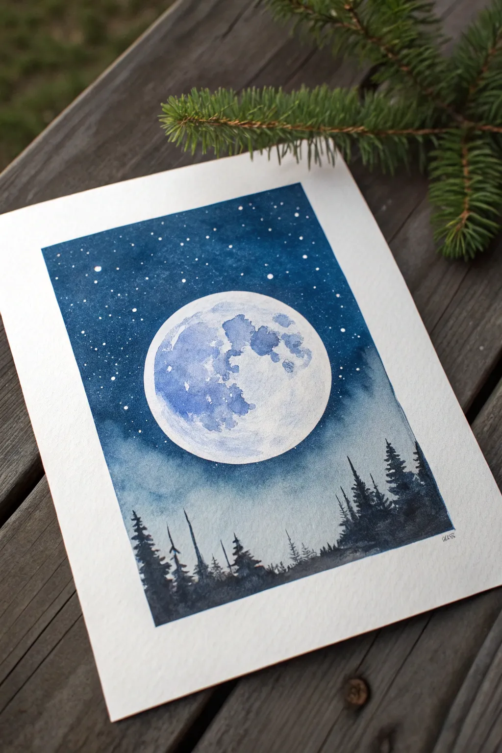 Double exposure moon painting idea: a tiny night landscape glowing inside a bold lunar circle.