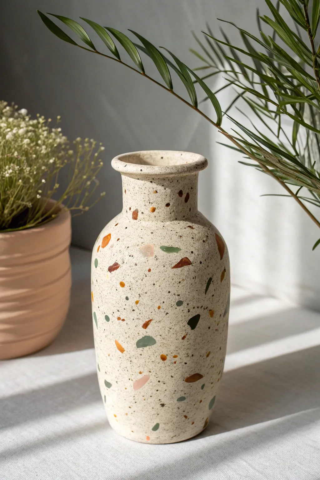 Modern mud vase with playful terrazzo speckles for a clean Scandinavian boho vibe.