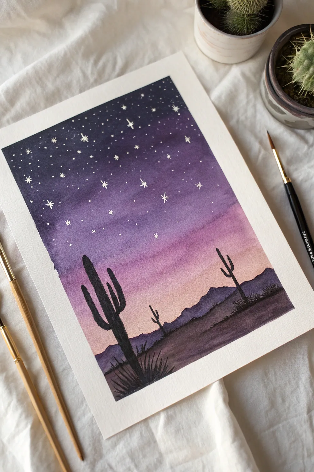 Deep violet desert night sky with crisp cactus silhouettes, a simple painting idea to try