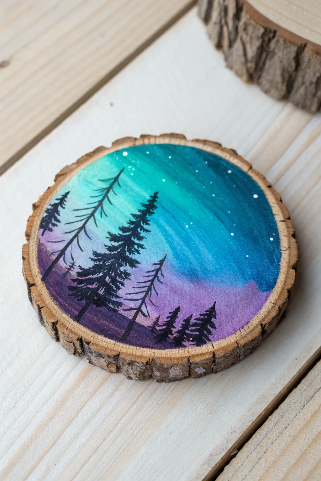 Paint a northern lights gradient on a wood slice ornament, finished with a crisp tree silhouette.