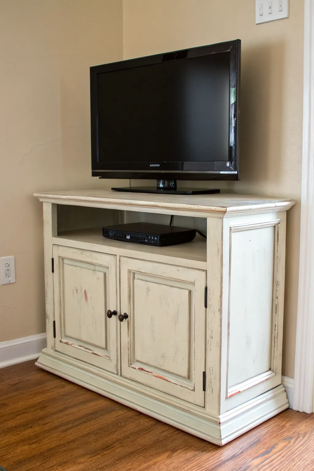 Distressed painted TV stand with sanded corners for effortless vintage charm