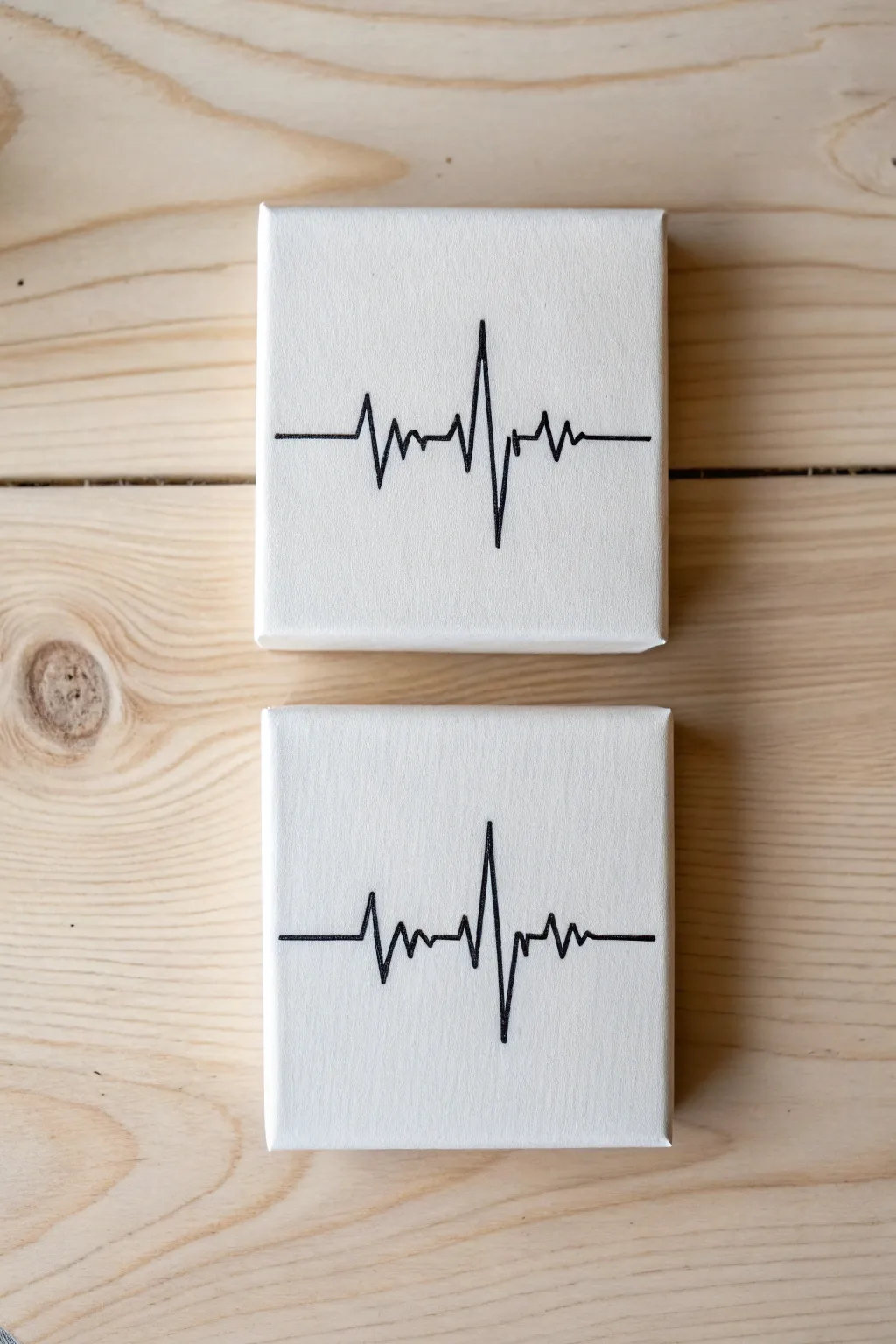 Two canvases, one heartbeat line—minimal Scandinavian-boho art for a cozy painting date.