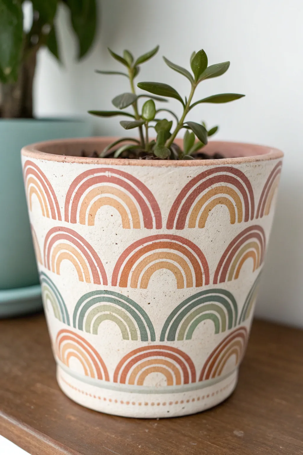 Soft rainbow arches on a cozy minimalist pot, a calming drawing idea for your next plant friend
