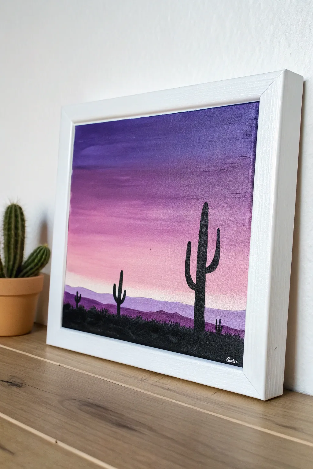 Purple desert sunset acrylic with bold cactus silhouettes, minimalist and calming to paint.