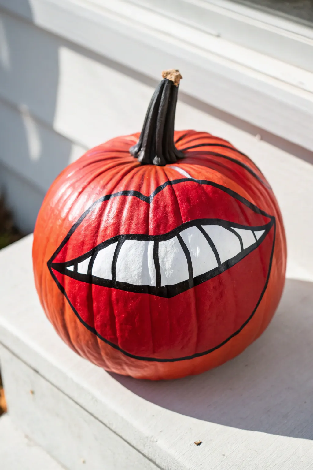 Minimal red pumpkin with bold pop-art lips on a bright Nordic backdrop for easy painting inspiration