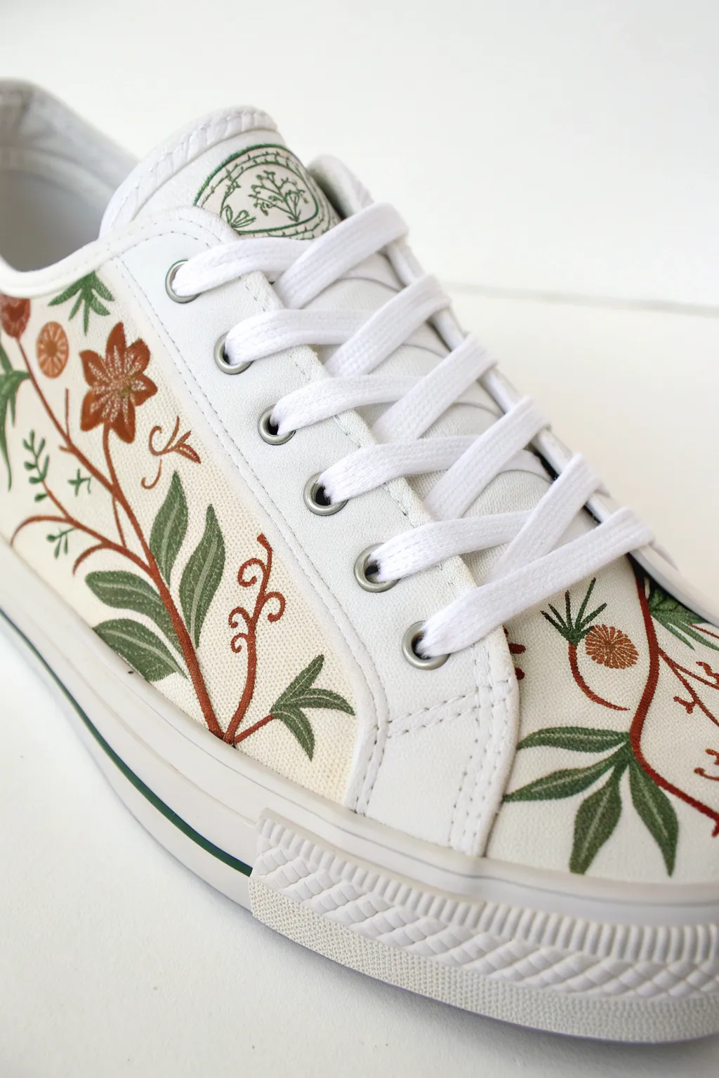 Wrap-around vines follow sneaker seams, creating clean framed panels with soft Scandinavian boho charm.