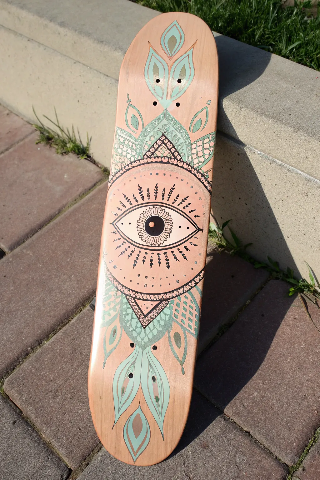 Bold giant eye skateboard art with glossy gradients and intricate boho patterns, clean minimalist style